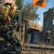 A player crouches behind a box for concealment.